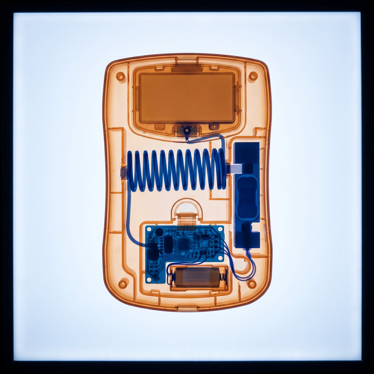 X-ray of a digital travel luggage scale on an illuminated lightbox, amber-orange outer body with cobalt blue internal spring mechanism